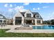 Luxury home with a large in-ground pool, hot tub, and covered patio for outdoor relaxation and entertaining at 7215 Alexander Rd # 4, Charlotte, NC 28270