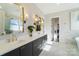 Bathroom features marble floors, dual sinks, gold fixtures, and custom cabinetry at 7215 Alexander Rd # 4, Charlotte, NC 28270