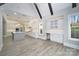 Spacious open kitchen with a large island, modern appliances, and a vaulted ceiling with wooden beams at 7215 Alexander Rd # 4, Charlotte, NC 28270
