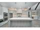 Bright kitchen featuring a large island, stainless steel appliances, and modern design at 7215 Alexander Rd # 4, Charlotte, NC 28270