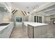 Modern kitchen featuring a large island with stainless steel appliances and elegant pendant lighting at 7215 Alexander Rd # 4, Charlotte, NC 28270