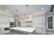 Well-appointed kitchen with a center island, custom cabinetry, and modern appliances at 7215 Alexander Rd # 4, Charlotte, NC 28270