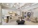 Spacious living room with hardwood floors, elegant lighting, open to the kitchen at 7215 Alexander Rd # 4, Charlotte, NC 28270