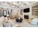 Inviting living room with a fireplace, coffered ceilings, built-in shelves, and hardwood floors at 7215 Alexander Rd # 4, Charlotte, NC 28270