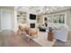 Bright and open living area featuring built-in shelves, a fireplace, and sliding doors to the patio at 7215 Alexander Rd # 4, Charlotte, NC 28270