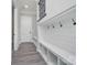 Hallway mudroom featuring built-in shelving, hooks, and storage, providing organization at 7215 Alexander Rd # 4, Charlotte, NC 28270