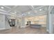 Open-concept layout with a modern kitchen, adjacent living area, and staircase at 7215 Alexander Rd # 4, Charlotte, NC 28270