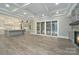 Spacious layout connecting the modern kitchen, living area, and outdoor access at 7215 Alexander Rd # 4, Charlotte, NC 28270