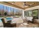 Relaxing patio with wood ceiling, ceiling fan, and view of the pool and landscaped backyard at 7215 Alexander Rd # 4, Charlotte, NC 28270