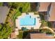 Aerial view of a community pool, landscaping, and surrounding residential buildings at 753 Southwest Dr, Davidson, NC 28036
