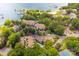 Scenic aerial view of waterfront condos with lush landscaping, a pool, and a private beach at 753 Southwest Dr, Davidson, NC 28036