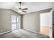 Well-lit bedroom featuring neutral walls, carpet floors and access to an outdoor space at 753 Southwest Dr, Davidson, NC 28036