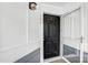 Inviting front door with black hardware and a screen door for cross ventilation and classic appeal at 753 Southwest Dr, Davidson, NC 28036