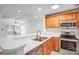 Kitchen with white countertops, stainless steel appliances, and open access to a bright sunroom at 753 Southwest Dr, Davidson, NC 28036