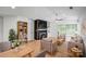Bright living room featuring hardwood floors, fireplace, vaulted ceilings, and modern decor at 753 Southwest Dr, Davidson, NC 28036