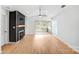 Bright living room boasts a modern fireplace, light wood floors, and sliding glass doors to the deck at 753 Southwest Dr, Davidson, NC 28036