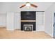 A cozy fireplace with wood mantel and built-in shelving adds character to this living space at 753 Southwest Dr, Davidson, NC 28036