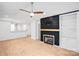 Spacious living area featuring a modern fireplace with wood mantel and built-in shelving at 753 Southwest Dr, Davidson, NC 28036