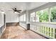 Inviting screened porch with wood flooring, ideal for relaxing and enjoying the outdoors at 753 Southwest Dr, Davidson, NC 28036