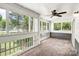 This serene screened-in porch offers tranquil views, creating a relaxing space to unwind outdoors at 753 Southwest Dr, Davidson, NC 28036