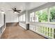 Inviting screened-in porch with ceiling fan and outdoor views, perfect for relaxing at 753 Southwest Dr, Davidson, NC 28036