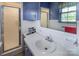 Cozy bathroom featuring a vanity, a window, and a tile shower at 765 York Institute Rd, Hiddenite, NC 28636