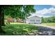Well-maintained property featuring a two-car garage adjacent to a charming brick house at 765 York Institute Rd, Hiddenite, NC 28636