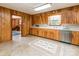Traditional kitchen with wood cabinets, a laminate countertop, and durable flooring, featuring a warm, inviting atmosphere at 765 York Institute Rd, Hiddenite, NC 28636