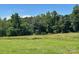 Beautiful lot with lush green field, perfect for building your dream home in a private and serene setting at 765 York Institute Rd, Hiddenite, NC 28636