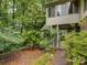 Backyard of house featuring a patio, lush trees and shrubbery at 8 Sunrise Point Rd, Lake Wylie, SC 29710