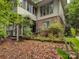Backyard view featuring lush landscaping and the home's exterior at 8 Sunrise Point Rd, Lake Wylie, SC 29710