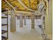 Exposed basement with painted floors, block supports, exposed ceiling and mechanicals at 8 Sunrise Point Rd, Lake Wylie, SC 29710