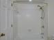 Clean bathroom with tiled walls, shower head, and tub at 8 Sunrise Point Rd, Lake Wylie, SC 29710