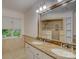 Bathroom with double sinks, granite countertops, and a large mirror at 8 Sunrise Point Rd, Lake Wylie, SC 29710