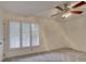 Bedroom with ceiling fan and bright, shuttered windows at 8 Sunrise Point Rd, Lake Wylie, SC 29710