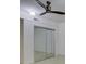 Bedroom with mirrored closet doors, neutral walls, and a ceiling fan at 8 Sunrise Point Rd, Lake Wylie, SC 29710