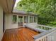 Spacious wood deck featuring a built-in bench and views of lush greenery at 8 Sunrise Point Rd, Lake Wylie, SC 29710