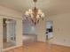 Elegant dining room featuring a decorative chandelier and hardwood floors at 8 Sunrise Point Rd, Lake Wylie, SC 29710