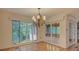 Formal dining room with beautiful chandelier and views to the sunroom at 8 Sunrise Point Rd, Lake Wylie, SC 29710