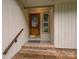 Covered entrance has brick steps and a leaded glass wooden front door at 8 Sunrise Point Rd, Lake Wylie, SC 29710