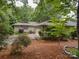 Charming single-story home with a well-maintained lawn and mature trees offering ample shade and curb appeal at 8 Sunrise Point Rd, Lake Wylie, SC 29710