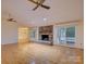 Spacious living room with hardwood floors, brick fireplace, and great natural light at 8 Sunrise Point Rd, Lake Wylie, SC 29710