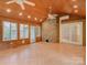 Inviting sunroom with brick accent wall, tile floors, and abundant natural light at 8 Sunrise Point Rd, Lake Wylie, SC 29710
