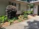 Landscaped yard features a concrete walk way lined with lush garden beds at 8 Sunrise Point Rd, Lake Wylie, SC 29710