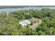 Aerial view of community pool, clubhouse, and manicured landscaping at 8066 Edgewater Dr # 103, Norwood, NC 28128