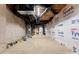 Spacious unfinished basement with exposed ceiling and wrapped walls, ready for customization at 8066 Edgewater Dr # 103, Norwood, NC 28128