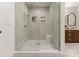 This elegant bathroom features a spacious walk-in shower with sleek tile and built-in shelving at 8066 Edgewater Dr # 103, Norwood, NC 28128