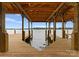 Covered boat slip with wooden structure overlooking the calm lake waters at 8066 Edgewater Dr # 103, Norwood, NC 28128