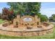 Stone Edgewater on Lake Tillery community entrance sign surrounded by manicured landscaping at 8066 Edgewater Dr # 103, Norwood, NC 28128