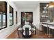 This cozy dining area features a round table with stylish chairs and a modern bar area for entertainment at 8066 Edgewater Dr # 103, Norwood, NC 28128